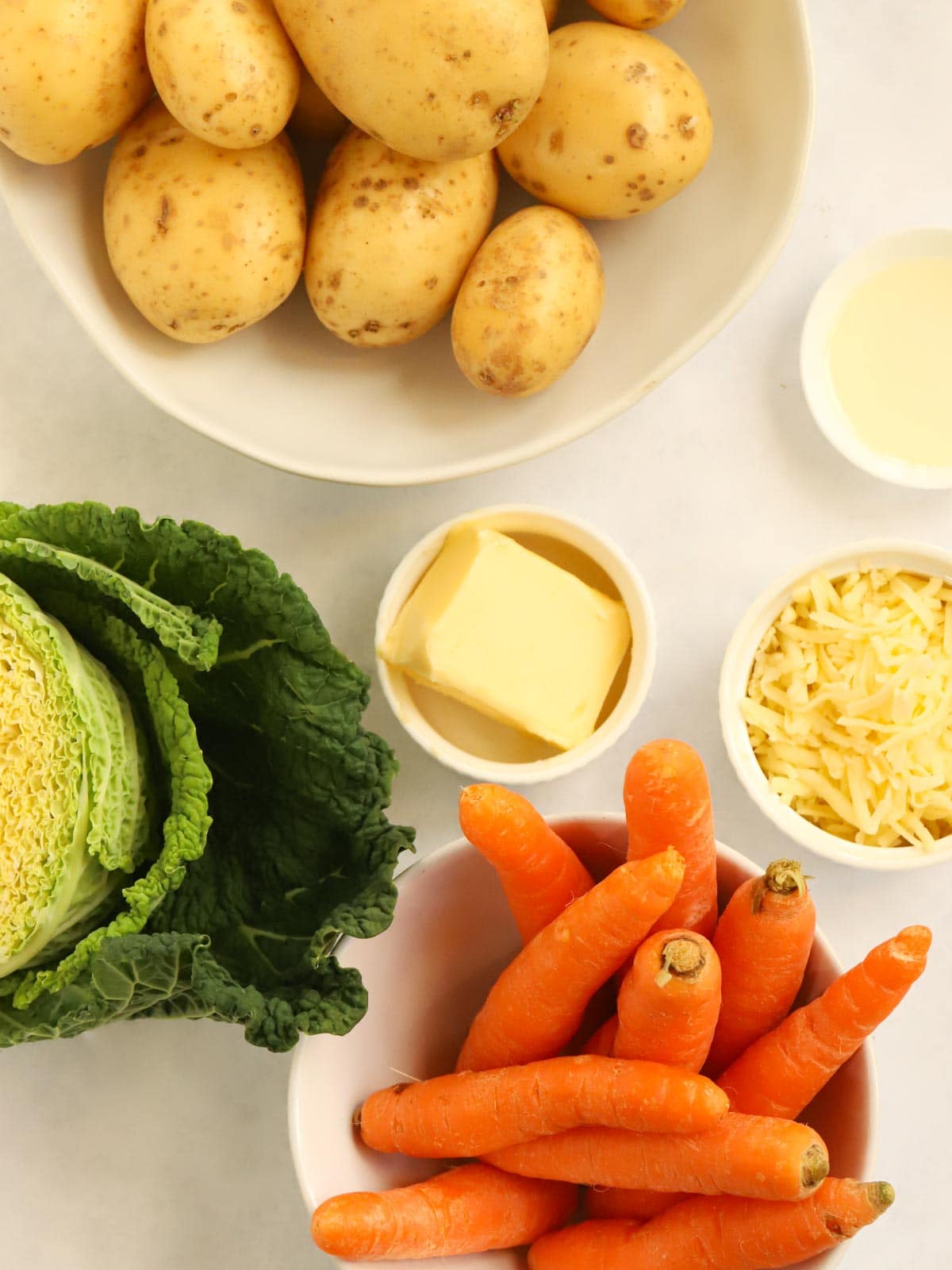 Ingredients for Bubble and Squeak recipe on a counter.