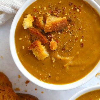 How to make Roasted Butternut Squash Soup. A big bowl of it topped with croutons.