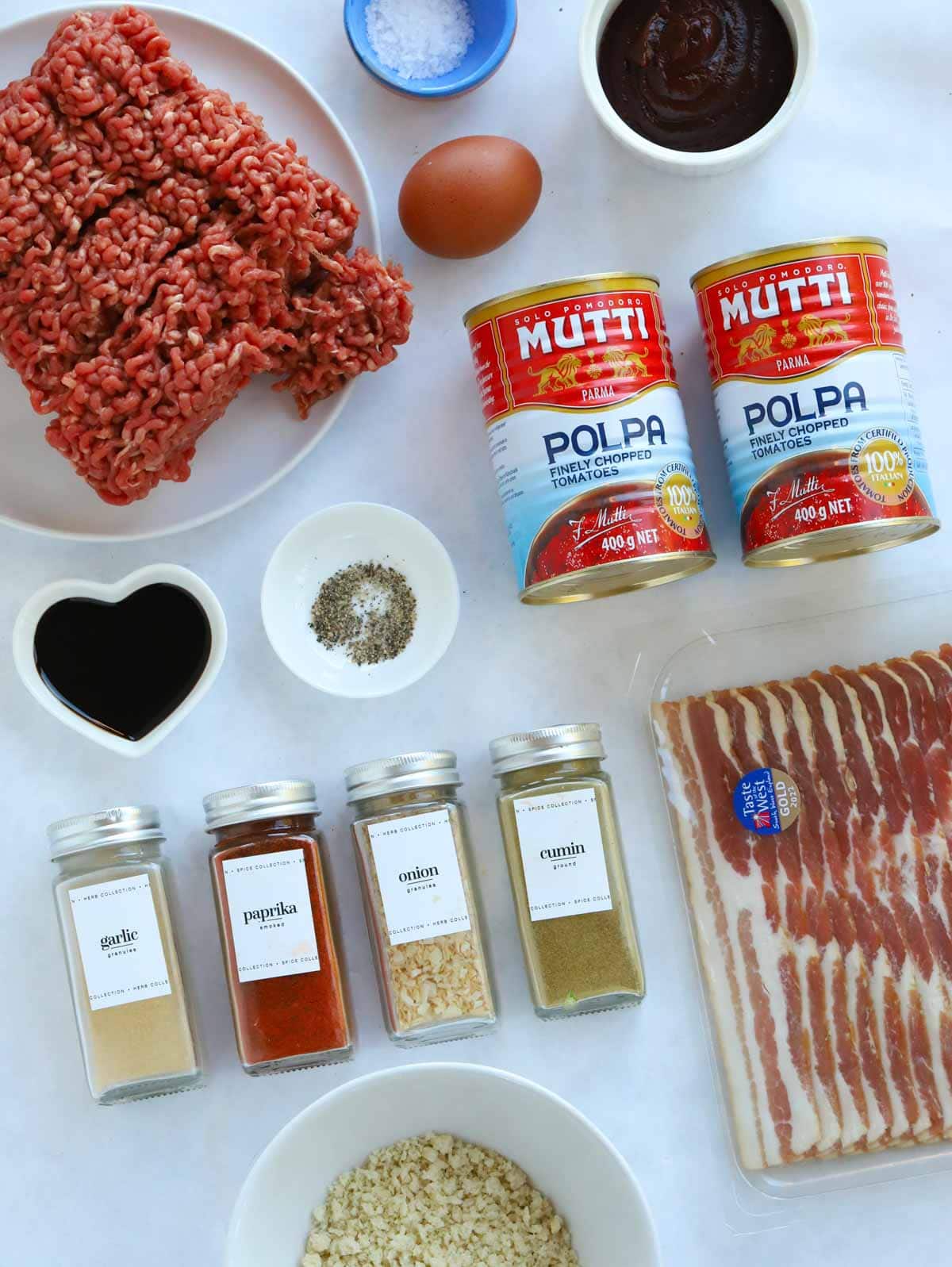 Ingredients for an easy meatloaf recipe laid out on a counter.