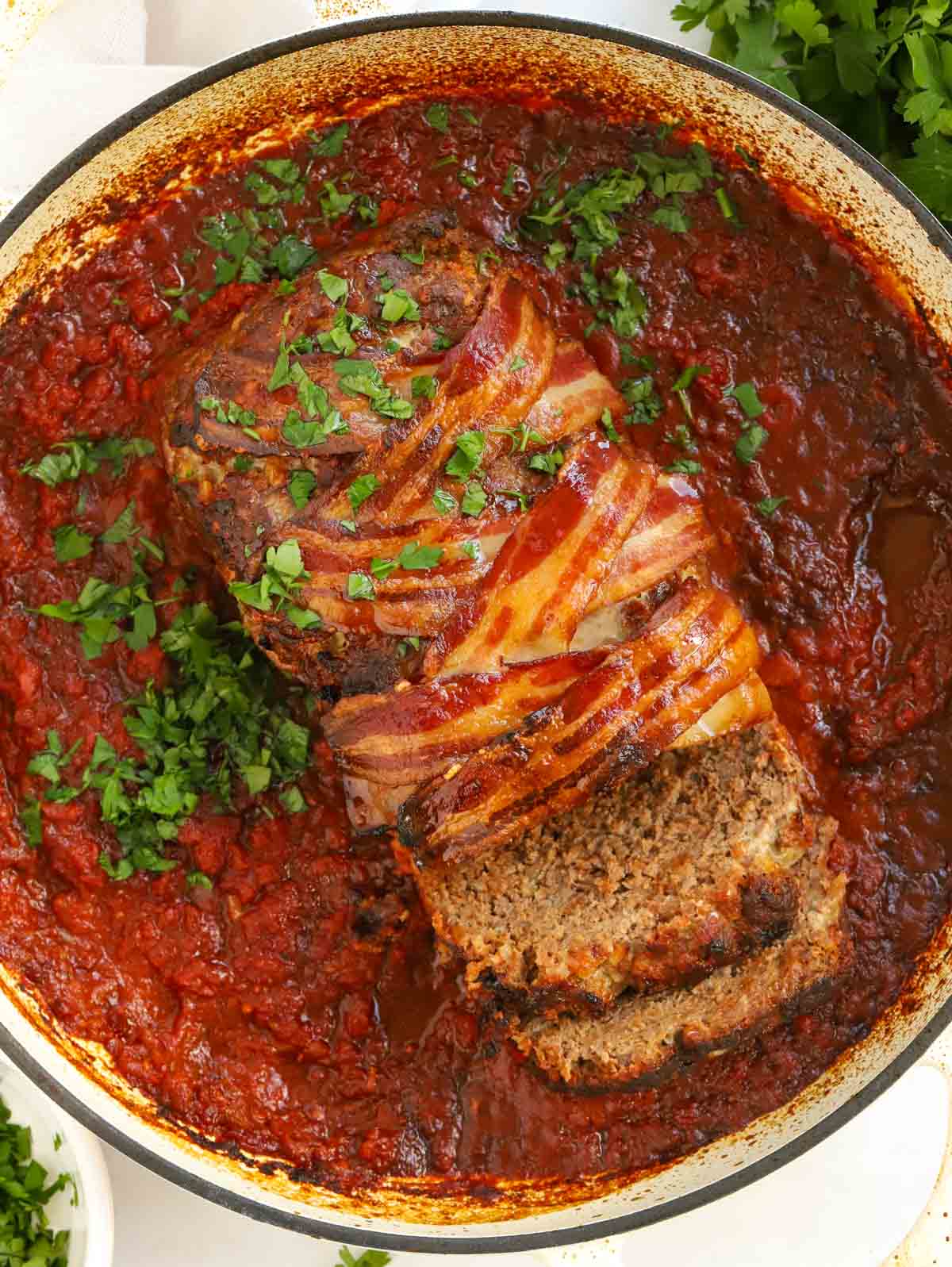 Pot filled with meatloaf in a sauce.