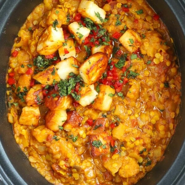 A finished Slow Cooker Dahl recipe topped with paneer and coriander.