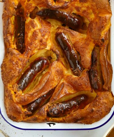 Browned sausages in a Yorkshire Pudding batter to make a perfect Toad in the Hole.