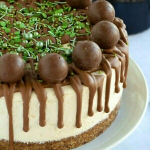 Baileys Cheesecake with chocolate topping on a plate.