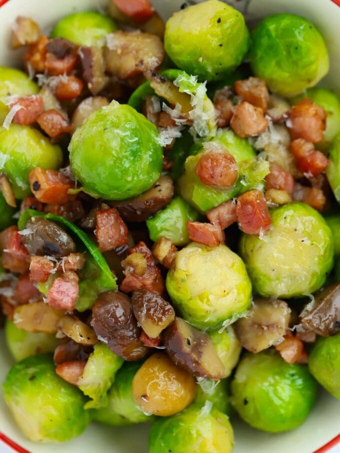 Close up of sprouts with bacon, chestnuts and parmesan.