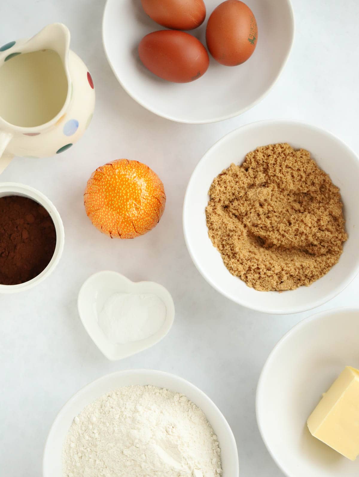 Ingredients for Slow Cooker Chocolate Orange Pudding laid on a counter top.