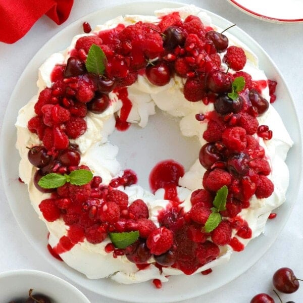 The perfect Christmas dessert for decorating the table. A Christmas Wreath Pavlova.