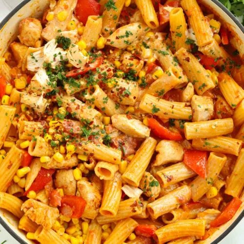 Large pot filled with peri peri chicken pasta.
