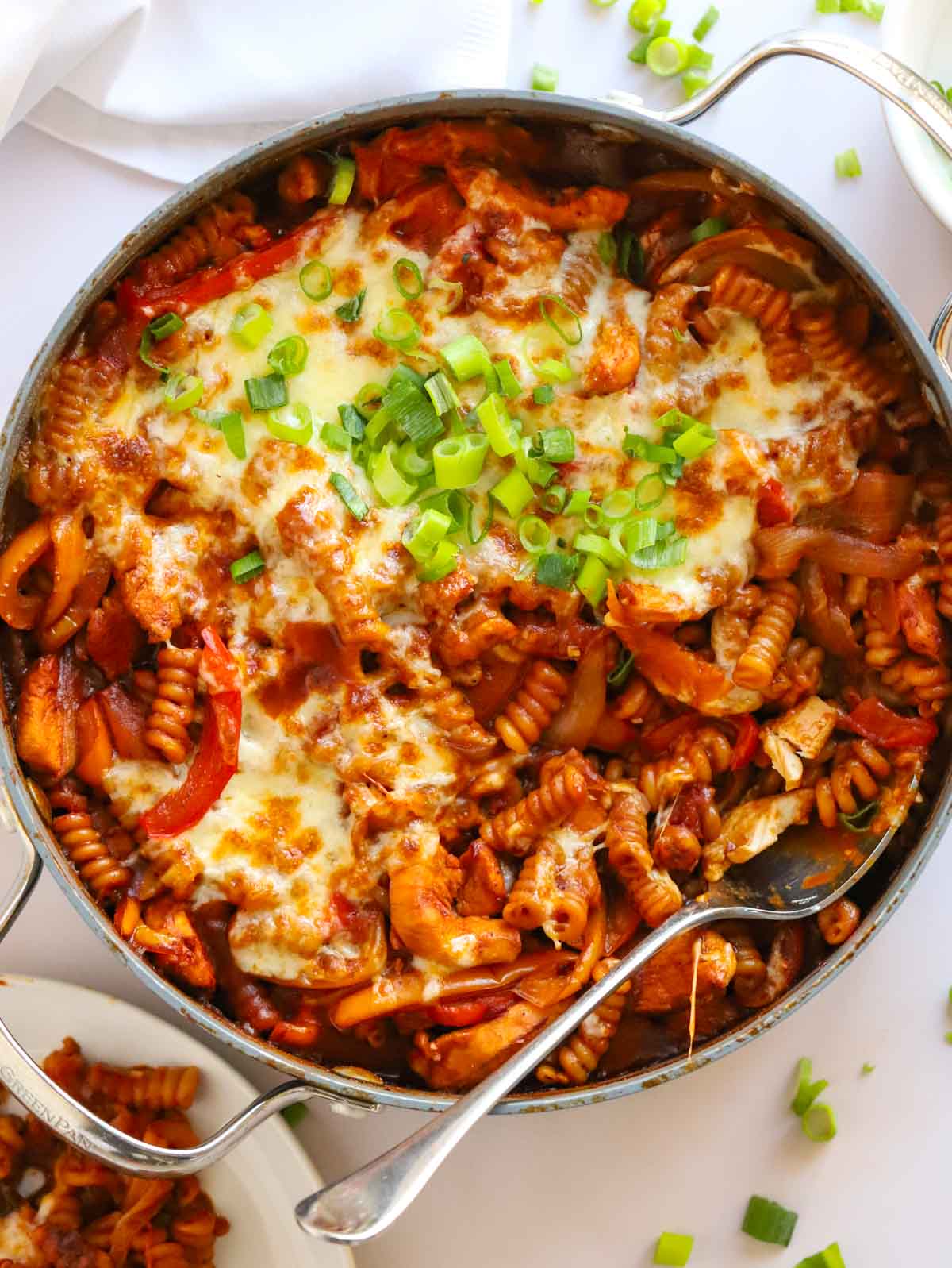 A big pan with a one pan chicken fajita pasta bake ready to be dished up.