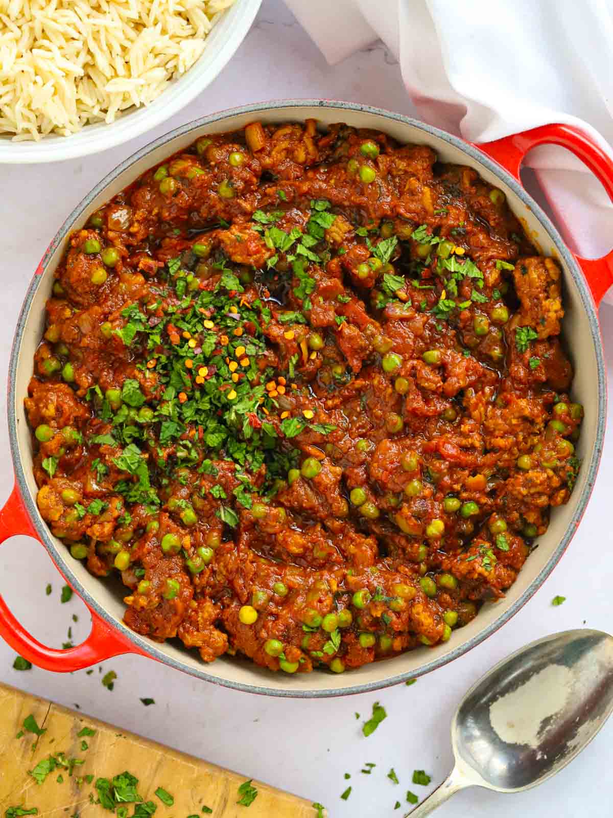 Large pot of cooked easy lamb keema curry, on a table, ready to be served.