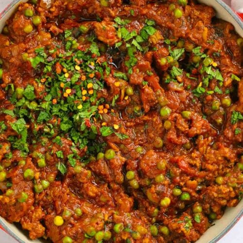 Keema curry with lamb mince and peas in a pan.