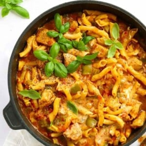 A big pan full of Cajun Chicken Pasta, topped with basil.