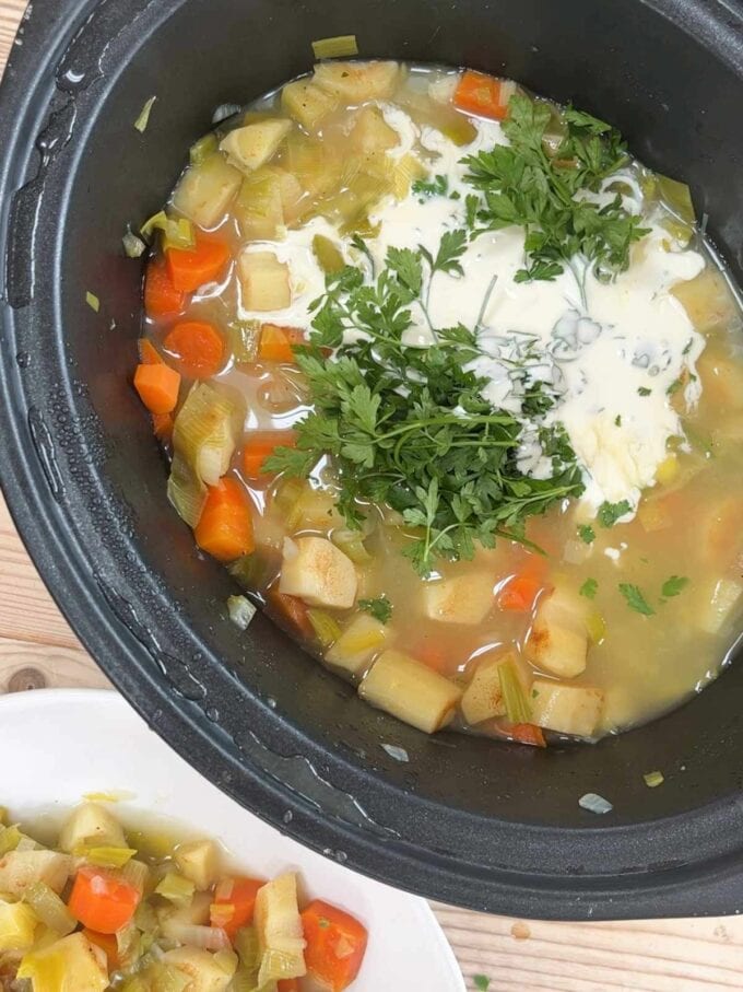 Step 2 in the slow cooker vegetable soup recipe. When cooked, add cream and parsley.