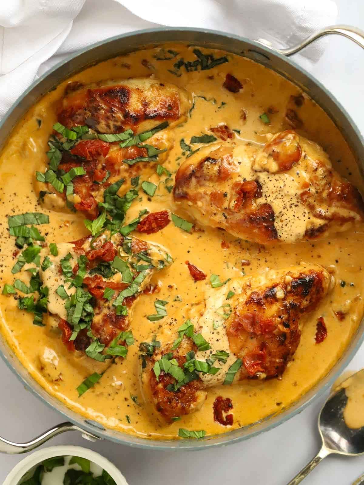 A pan filled with cooked Marry Me Chicken, ready to be served.
