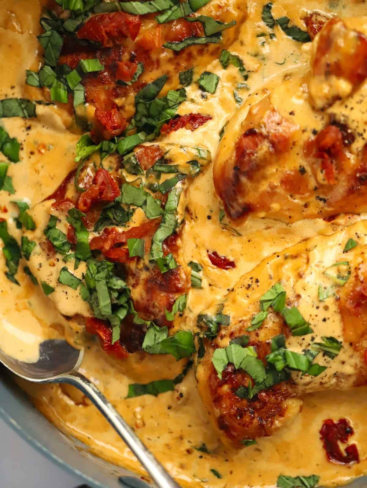 A close up of chicken in a sauce, ready to be served. Marry Me Chicken recipe.