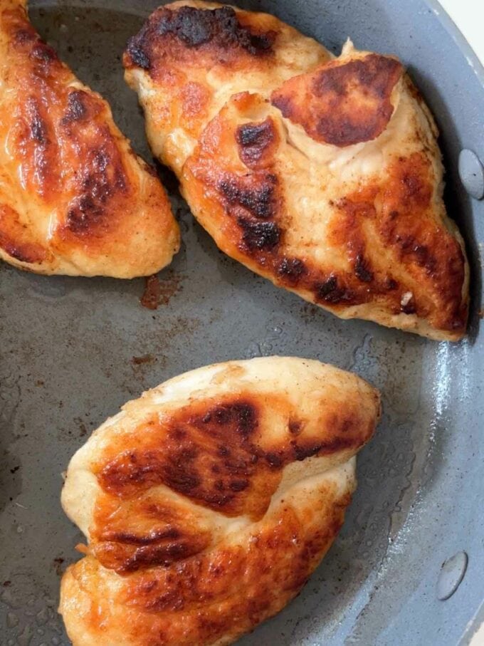 Chicken breasts being pan-fried in a pan for the recipe Marry Me Chicken. Step 2.