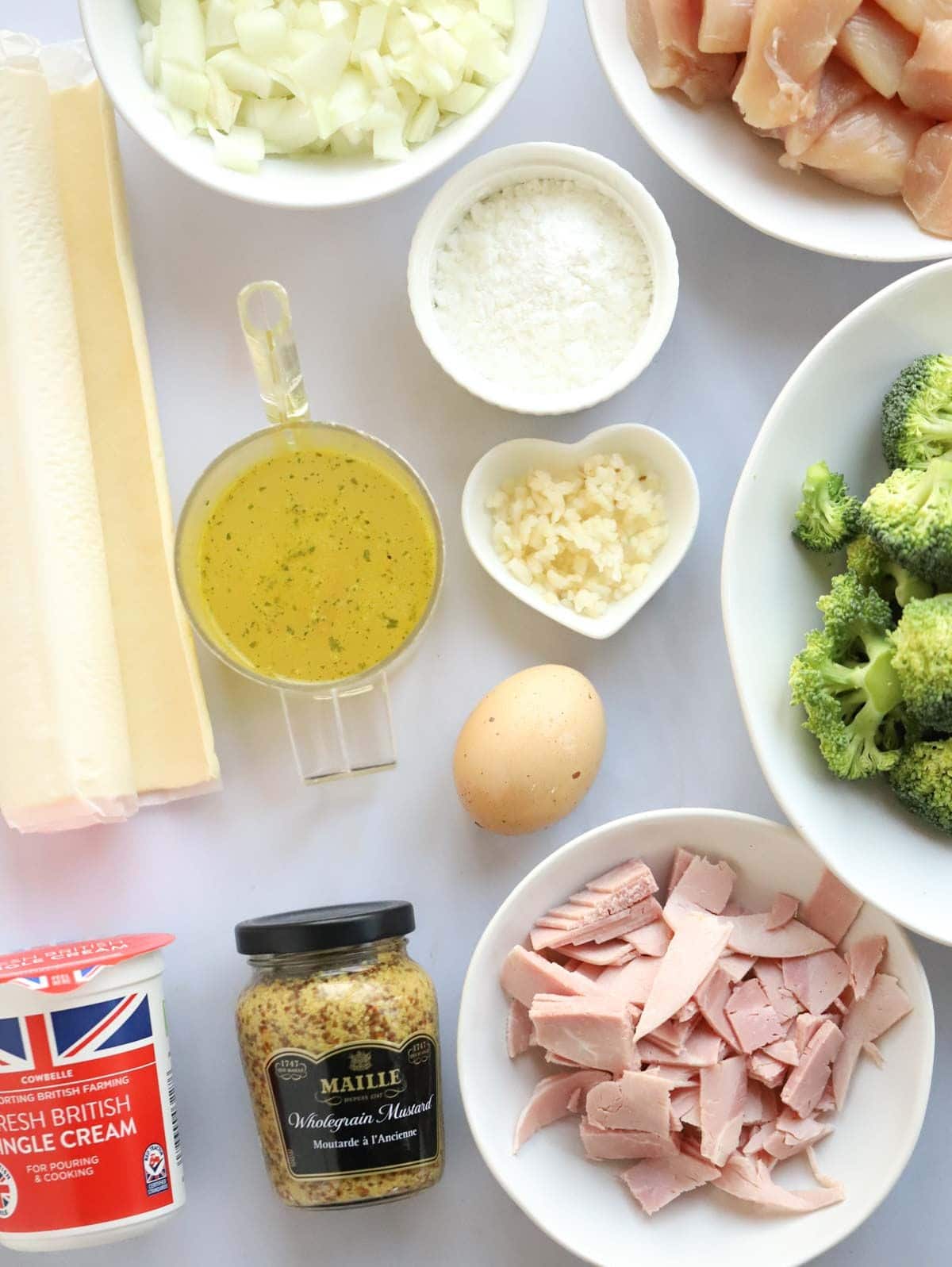 Ingredients for Chicken and Ham Pie laid out on a counter.