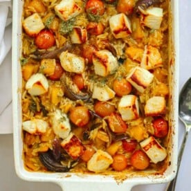 Cooked Orzo Bake with tomatoes and halloumi.