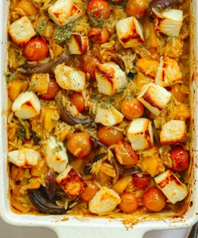 Cooked Orzo Bake with tomatoes and halloumi.