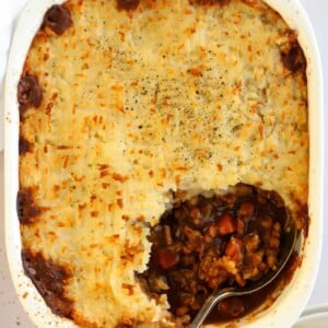 A close up of Vegetarian Cottage Pie cooked dish being served up for dinner.