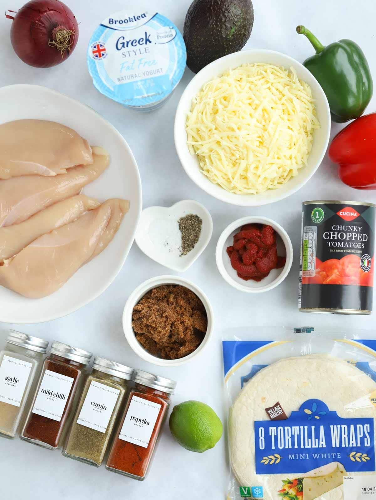 Ingredients for Slow Cooker Chicken Tacos laid out on a counter top.