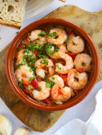 A tapas dish filled with Gambas Pil Pil. Prawns in garlic and chilli infused oil