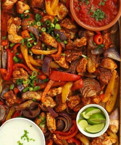A baking tray with chicken oven fajitas ready to eat.