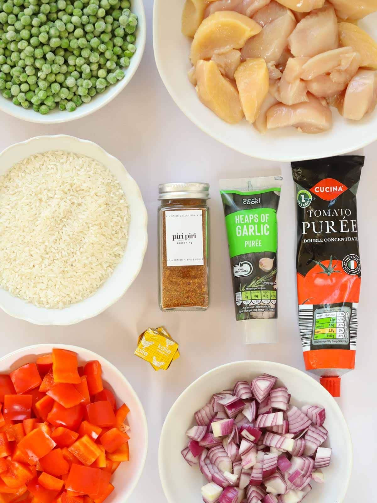 Ingredients for Peri Peri Chicken and Rice One Pot recipe laid out on a counter.