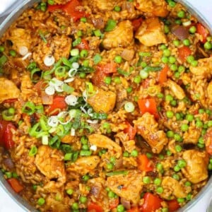 Chicken, rice and vegetables seasoned with Peri Peri in a big pot for a family dinner.