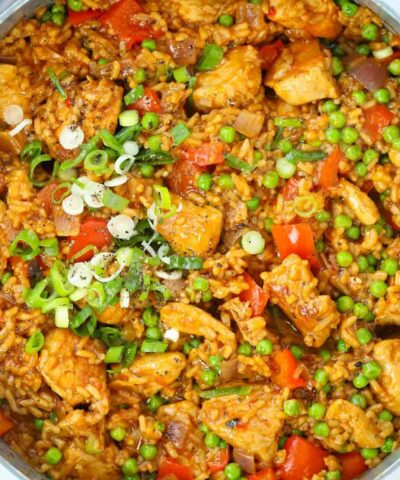 Chicken, rice and vegetables seasoned with Peri Peri in a big pot for a family dinner.