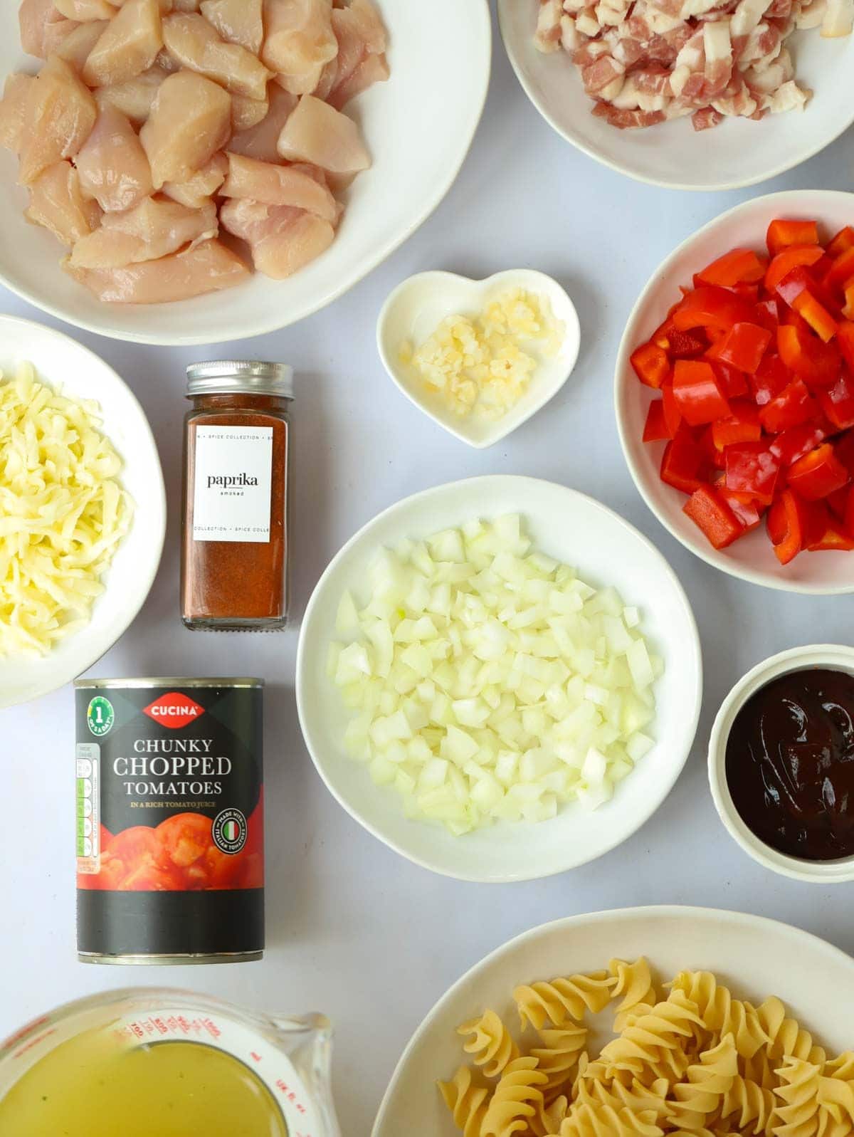 The ingredients for the recipe BBQ Chicken Pasta all laid on a counter top.