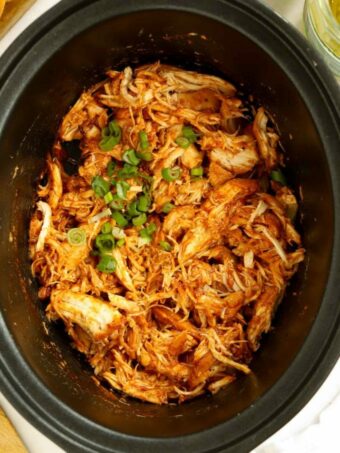 Pulled barbecue chicken cooked in a slow cooker.
