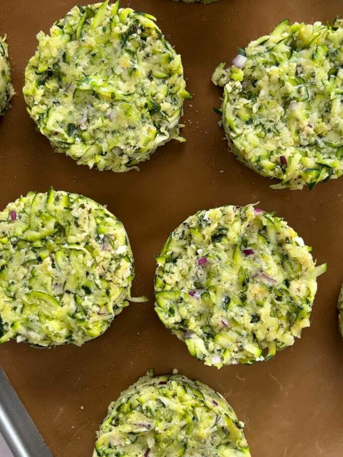 How to make Courgette Fritters. Step 4. Set the patties on a baking tray and cook in the oven.