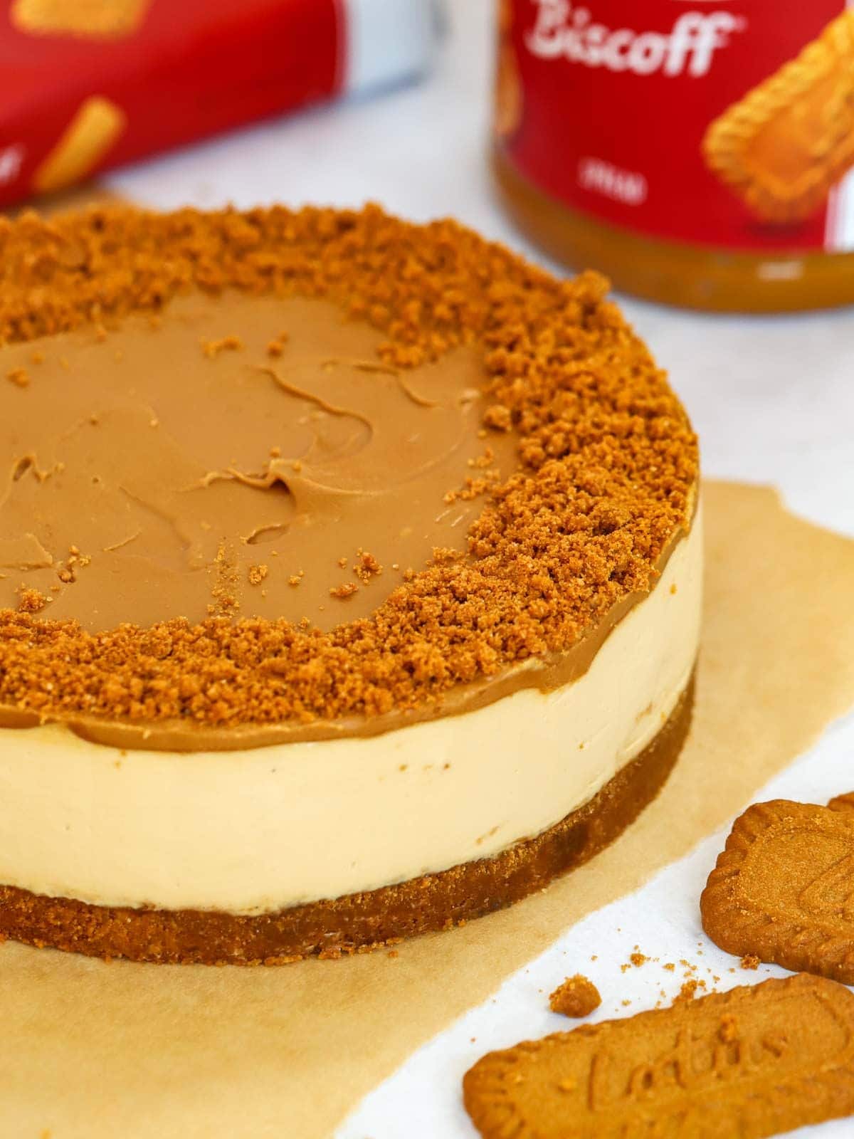 A Biscoff cheesecake on a table, ready to be served.