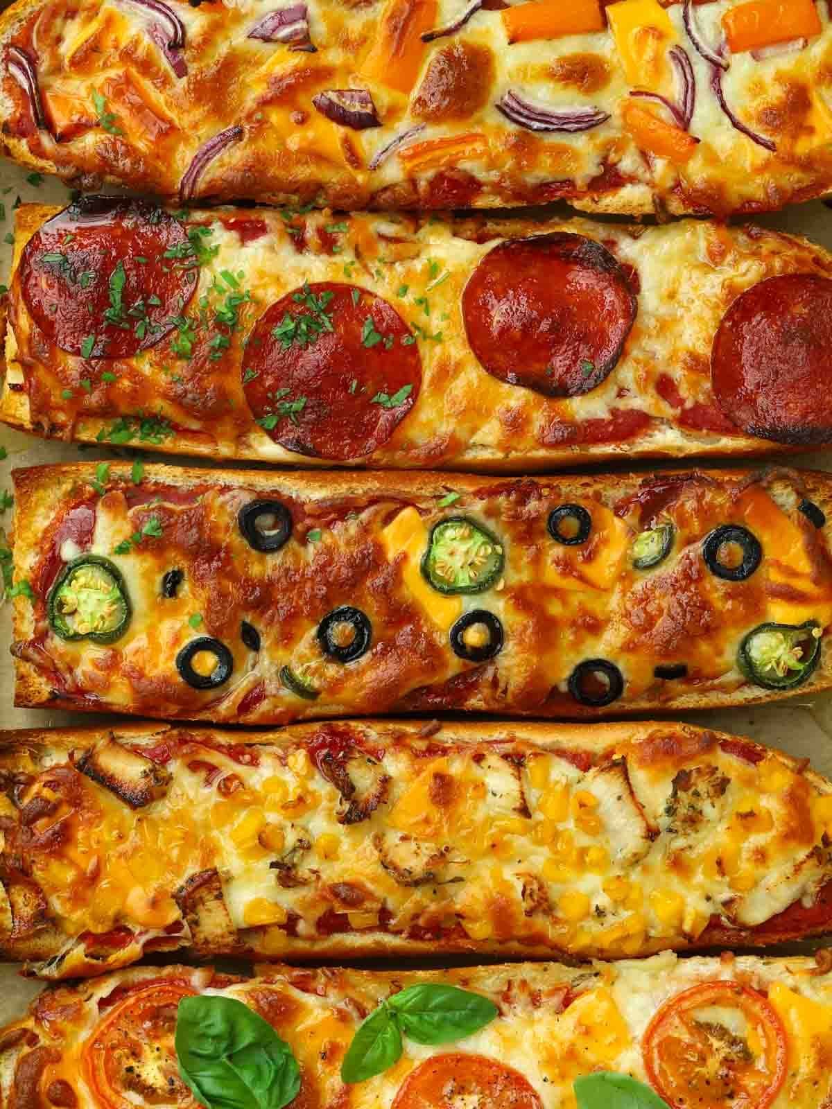 Cooked French Bread Pizzas with a variety of toppings and ready to eat.