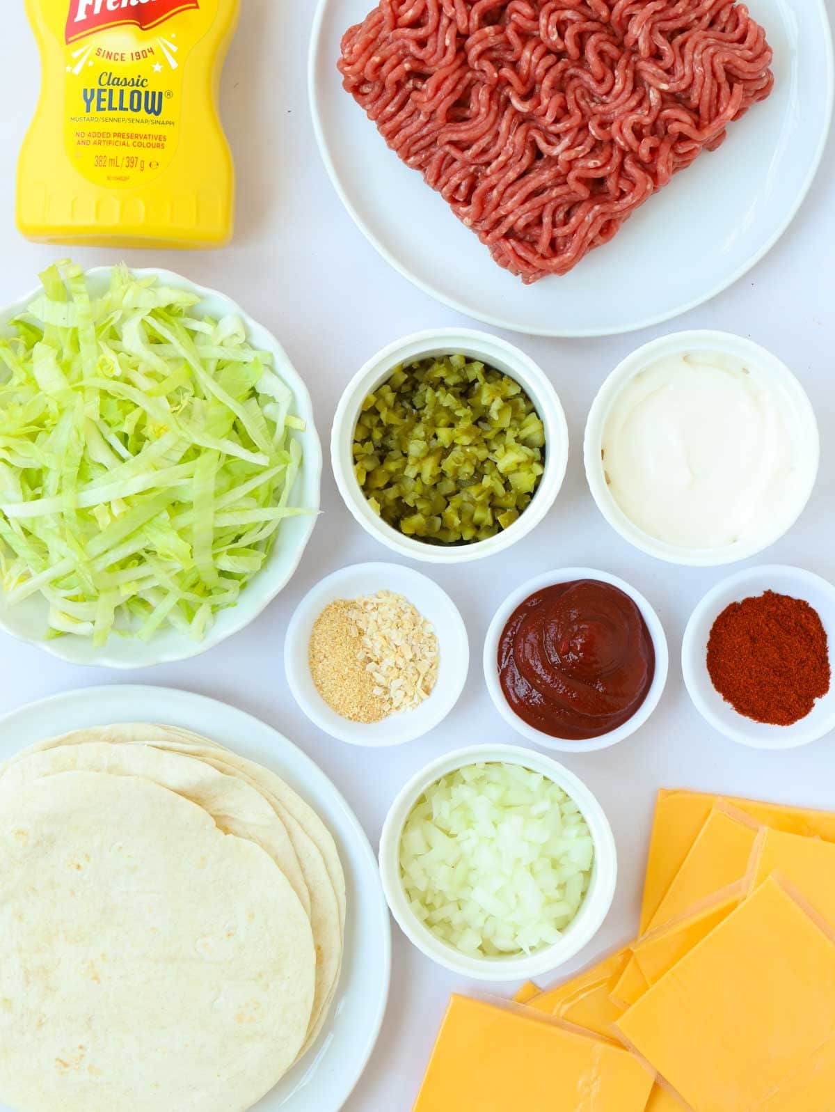 Ingredients for Big Mac Tacos laid out on a counter.