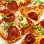 Delicious and easy naan bread pizzas topped with cheese and pepperoni.