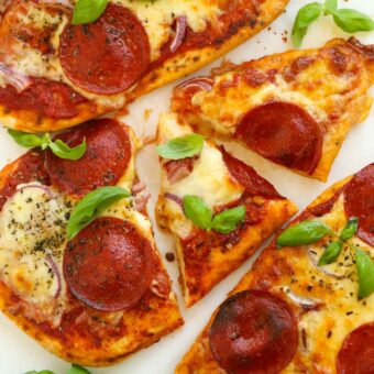 Delicious and easy naan bread pizzas topped with cheese and pepperoni.