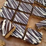 Deliciously, moreish and easy to make tea time treats. Packed with peanut butter and topped with a slab of milk chocolate, these are a must bake!