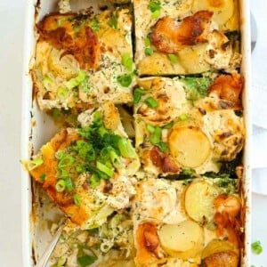 Sliced salmon bake with potatoes and broccoli, ready to serve.