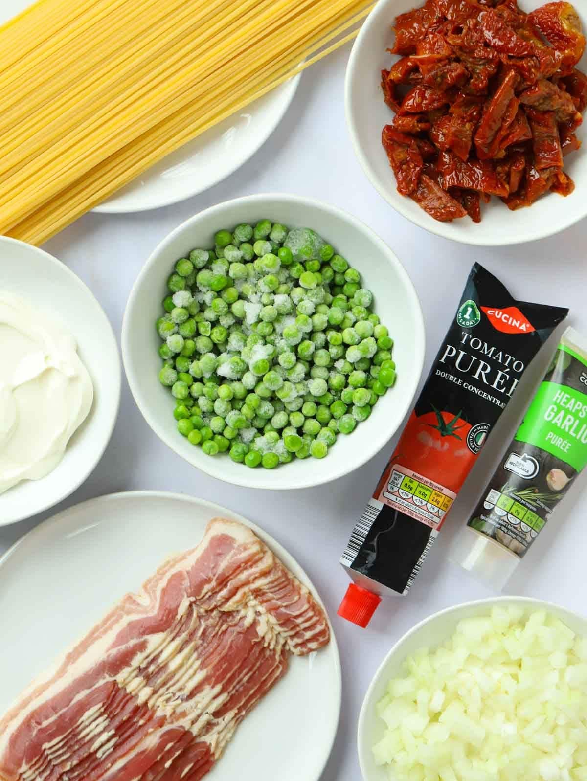 The ingredients for Bacon Pasta recipe laid out on a counter.