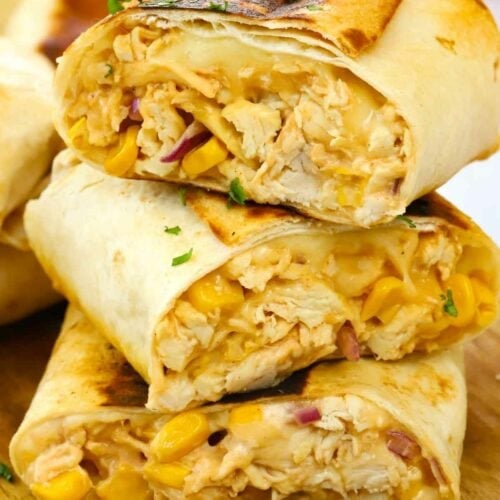 Wraps with a chicken and sweetcorn filling, ready to be eaten.