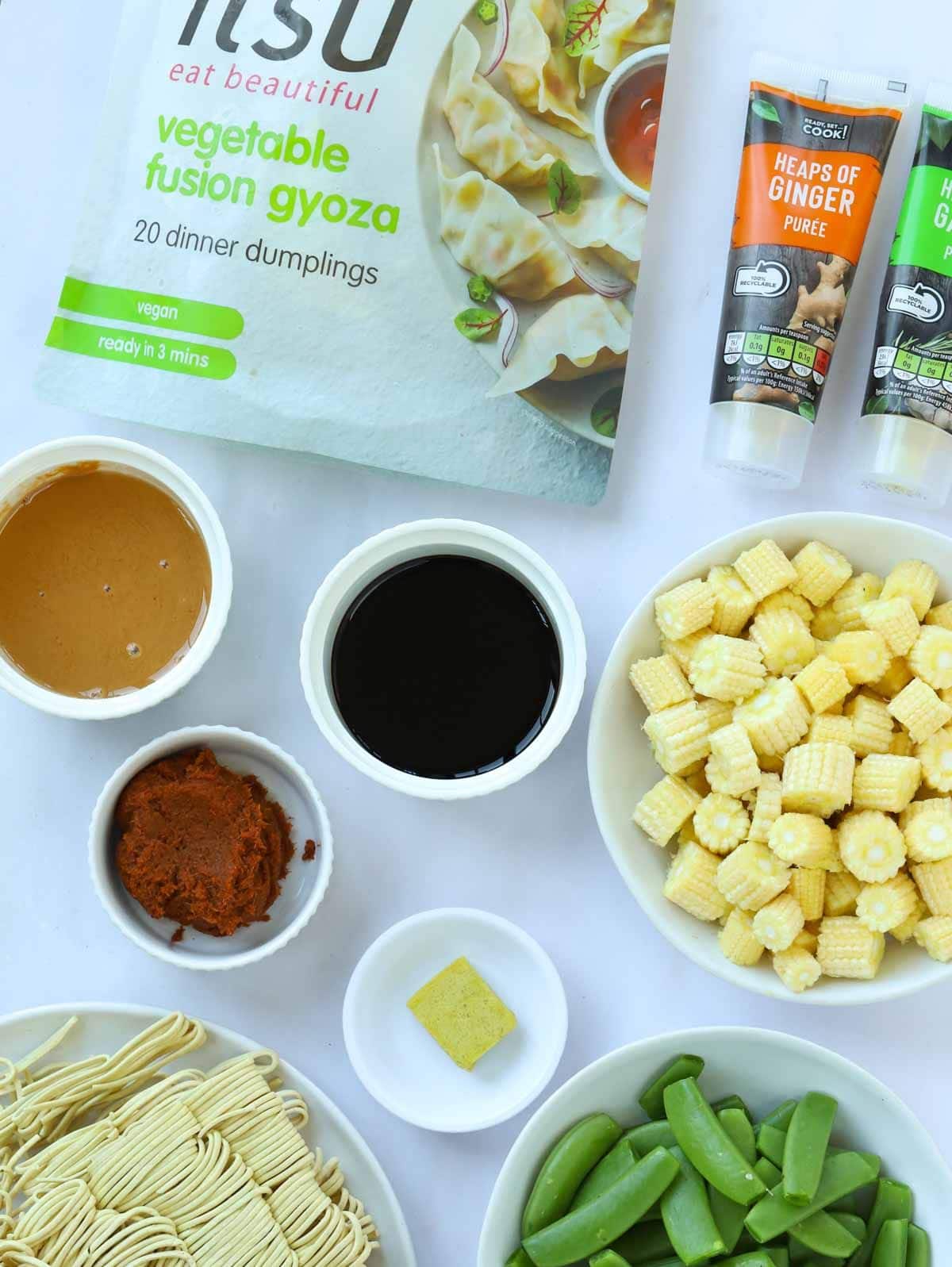 Ingredients for a Gyoza Soup recipe laid out on a table.