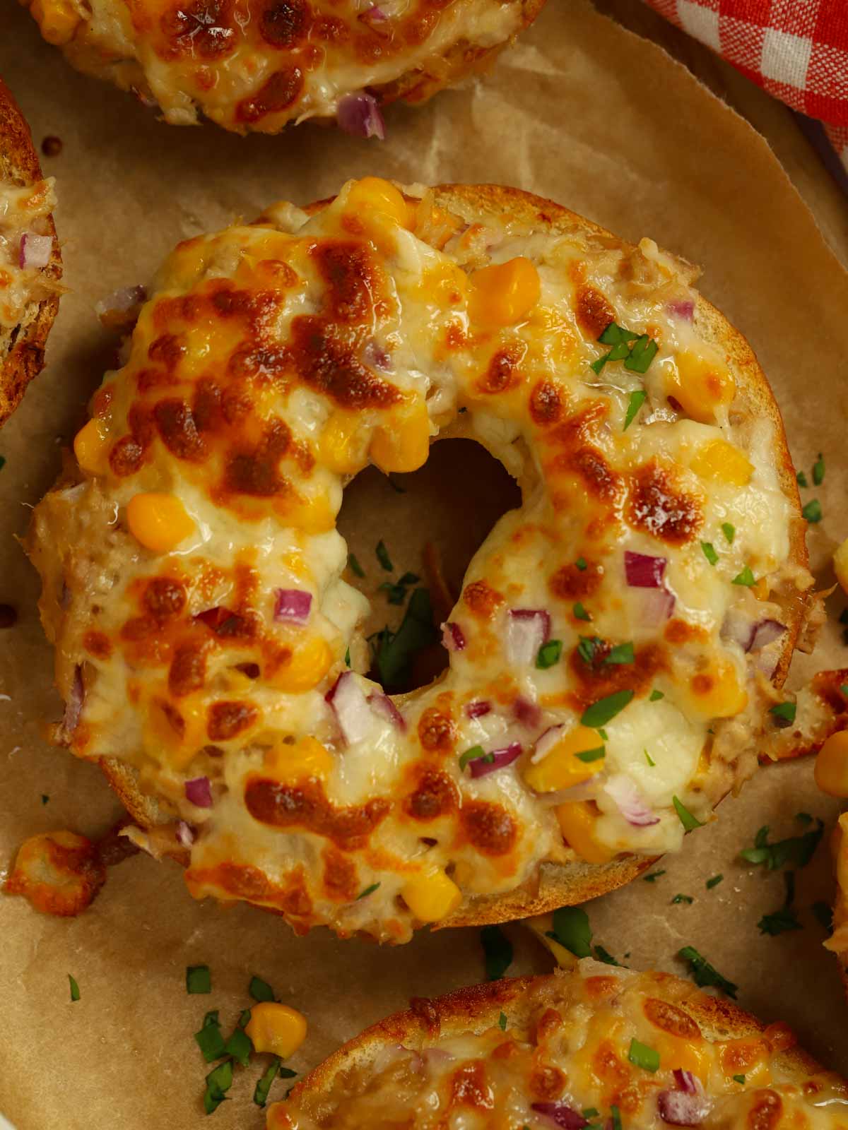 Tuna melt bagel with mozzarella cheese and sweetcorn.