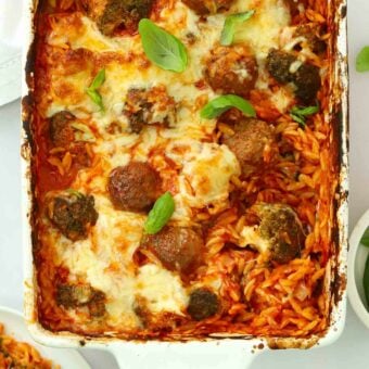 A dish straight out of the oven for the recipe Meatball Orzo Bake.