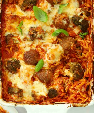 A dish straight out of the oven for the recipe Meatball Orzo Bake.