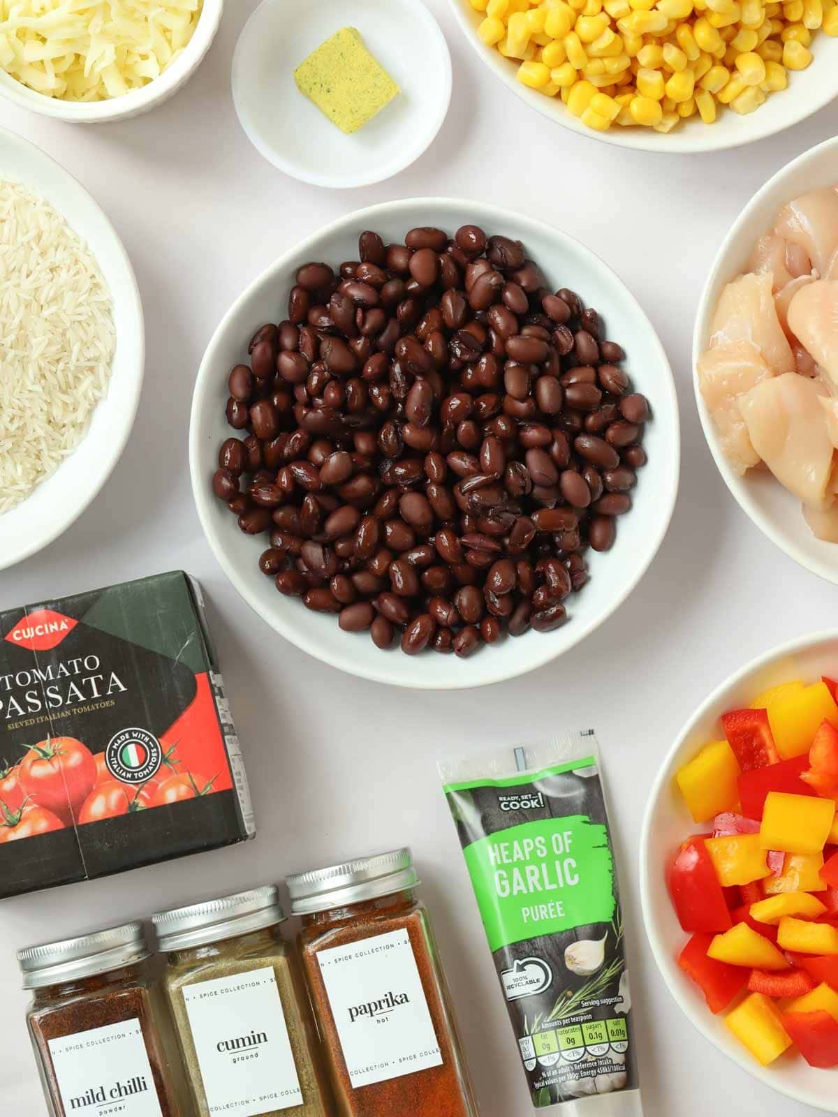 Ingredients for Mexican Chicken and Rice One Pot laid out on a counter top.