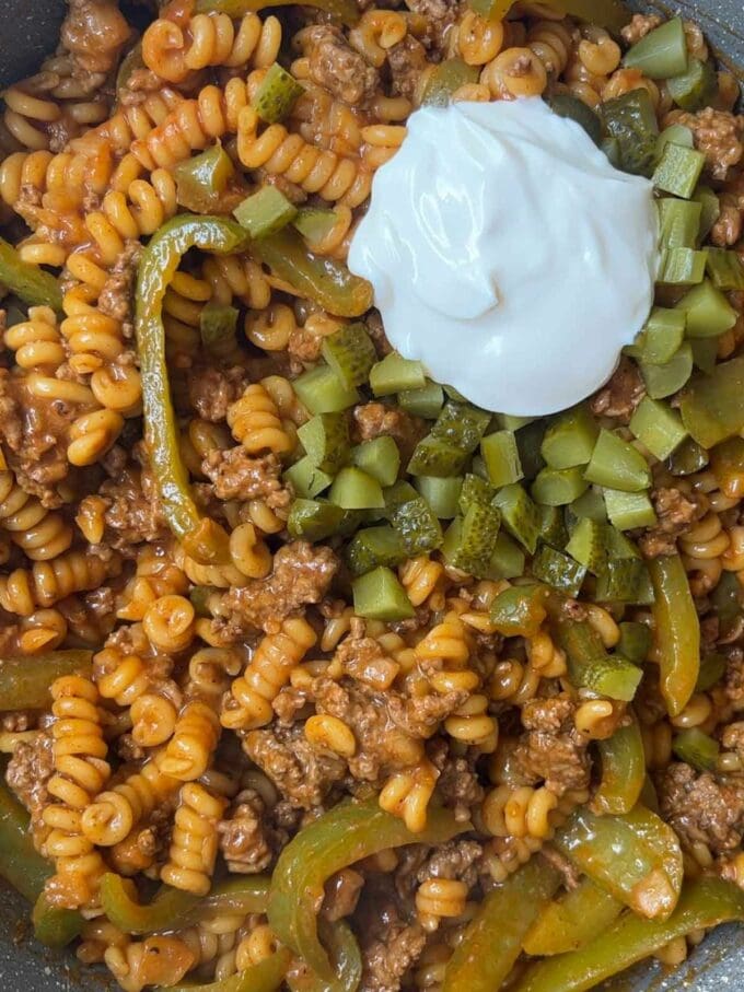 Ingredients cooking in a pan for step 3 in the recipe Cheeseburger Pasta.