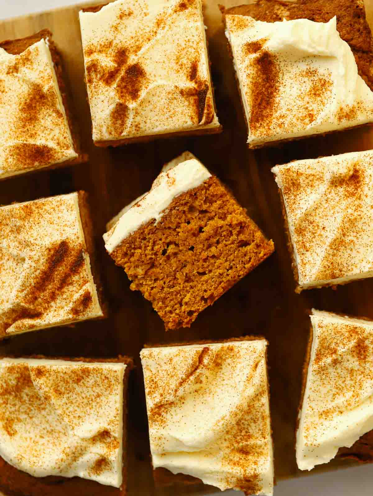 Squares of pumpkin cake covered with 