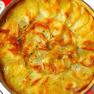 Sliced potatoes cooked to a golden topping for the side dish Boulangere potatoes, ready to serve.