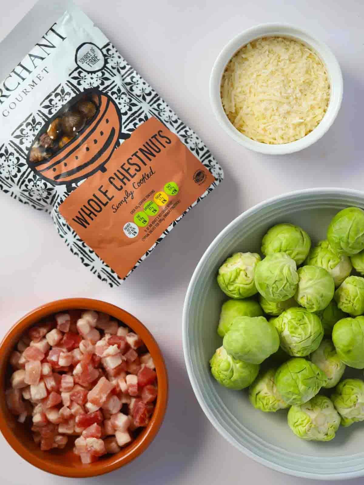 The raw ingredients for sprouts with bacon side dish laid out on a counter top.